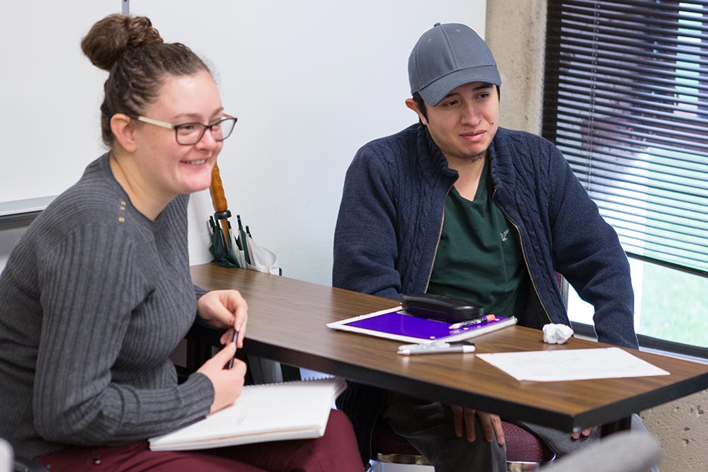 Student and advisor at a desk