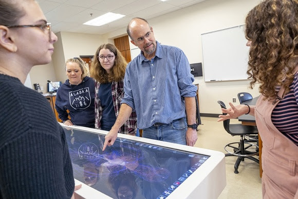 WOU teacher in class with students