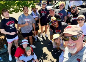 President Peters with WOU students