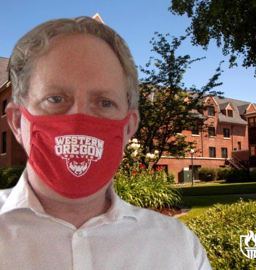 mask selfie - Rob Rob Winningham in front of a virtual background wearing a red WOU non-surgical mask