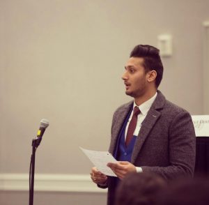 Kranti speaking at microphone