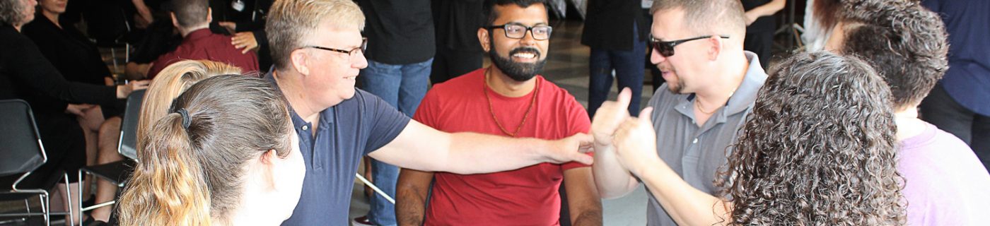 Deaf Interpreter Conference: group of people using sign language to communicate