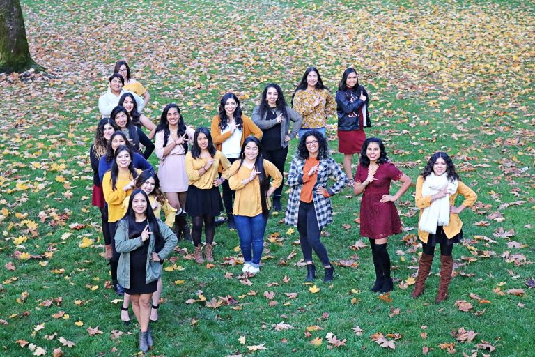 The Kappa Delta Chi Members posing outside forming a capital K.