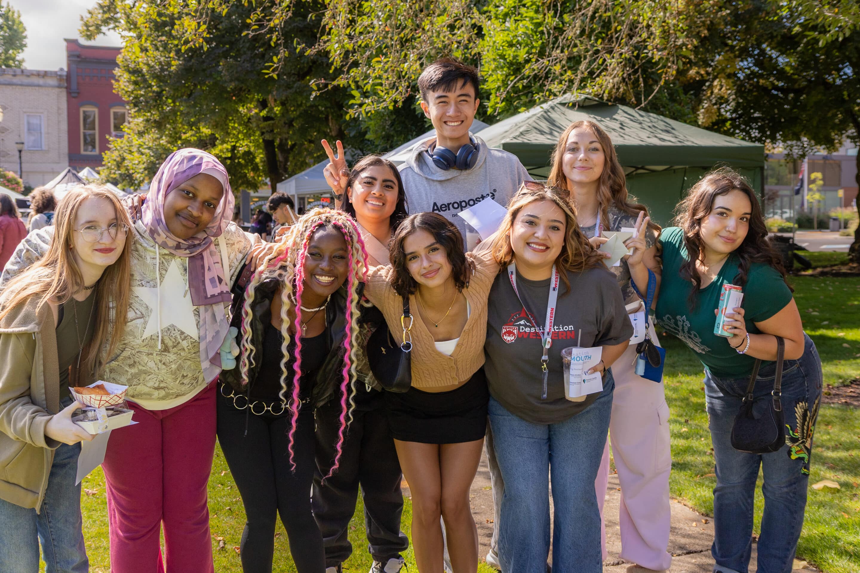 group of students outside in grass area